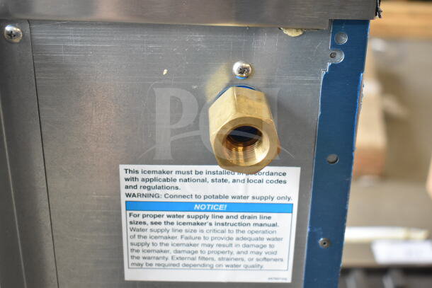 BRAND NEW Hoshizaki AM-50BAK undercounter ice machine, showing water connection port and installation instructions label.