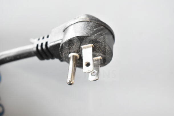 Close-up of a power plug for the Hoshizaki AM-50BAK ice machine, showing its prongs and condition.