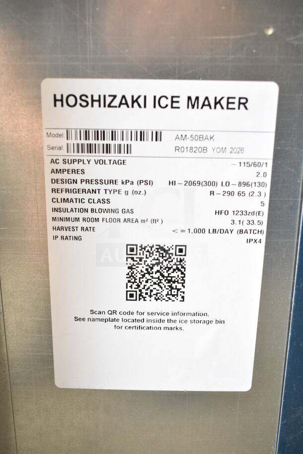 Alt text: Tag on Hoshizaki AM-50BAK ice machine, displaying model, serial number, design pressure, and voltage information.