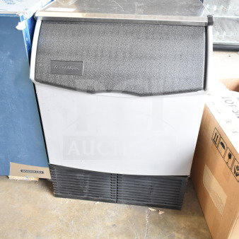 Brand new 2026 Ice-O-Matic CIMU220FA90 undercounter ice machine, 223 lb capacity, 74 lb bin, model tag visible, slightly scratched.