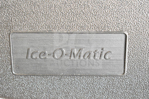 Brand new Ice-O-Matic CIMU220FA90 undercounter ice machine label. Model text embossed on textured metal surface.