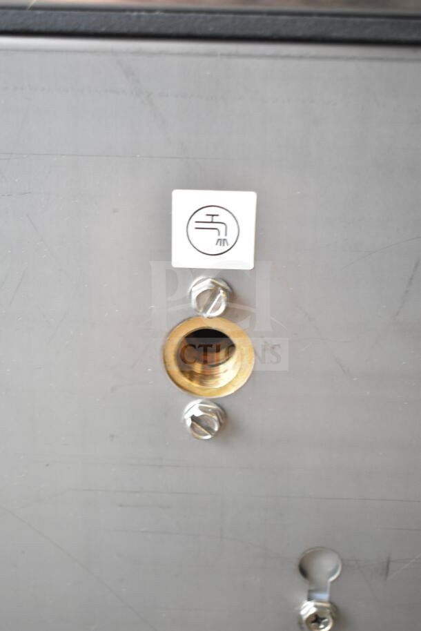 BRAND NEW Ice-O-Matic CIMU220FA90 undercounter ice machine detail; brass connector, light scratches visible.