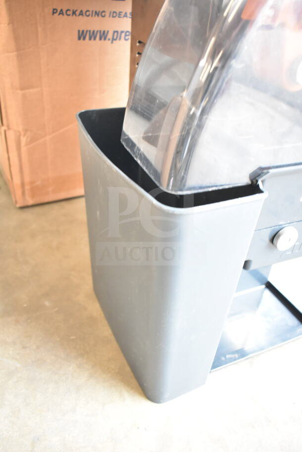 Brand new Zummo Z1-NGP commercial orange juicer, graphite finish, processes 6 fruits/minute, 110-120V, slight scratches.