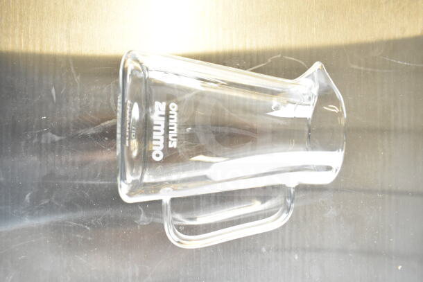 Brand new Zummo Z1-NGP Nature Compact Graphite Commercial Orange Juicer, for 6 fruits/min. Visible branding on glass jug.