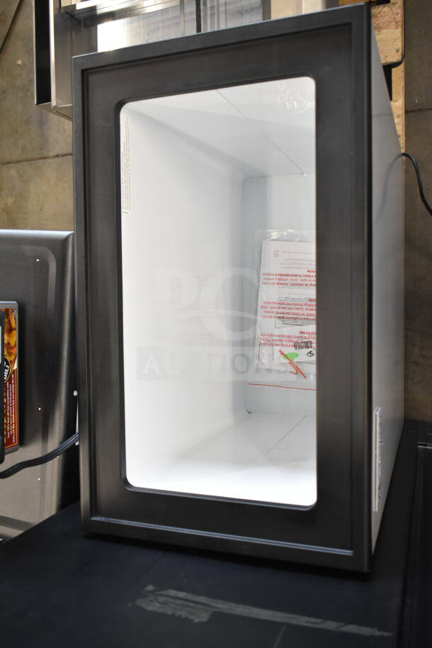 Brand new Avantco ICF-4 ice cream freezer. Four tub capacity. Model 360ICF4. Minor scratches and dents visible.