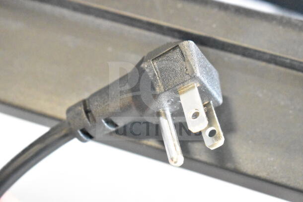 Three-prong power plug of Avantco 360ICF4 ice cream storage freezer, showcasing electrical compatibility.