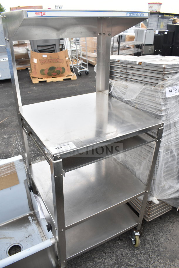 Stainless steel cart with over shelf and 2 under shelves on commercial casters, slightly used.