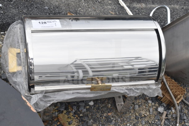 Stainless steel roll top chafer, sleek design, handle detail, auction tag with quantity visible, pristine condition.