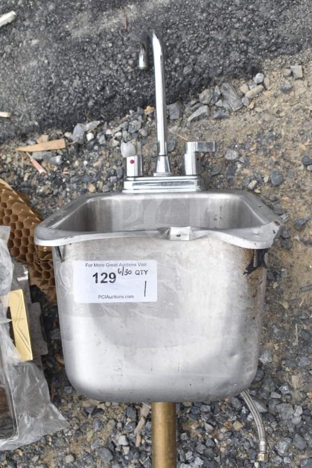 Single bay drop-in sink with faucet and handles. Slightly worn condition. Auction label marked PCI Auctions, item 129.