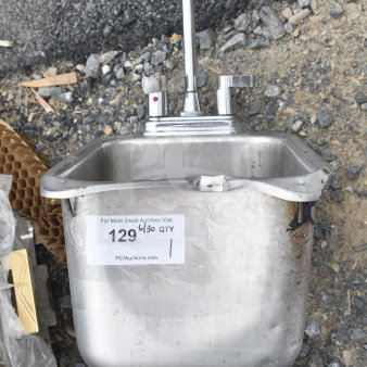 Single bay drop-in sink with faucet and handles. Slightly worn condition. Auction label marked PCI Auctions, item 129.