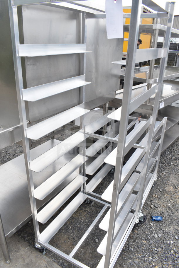 Brand new metal pan transport rack with scratch and dent, featuring commercial casters, multiple shelves, and sturdy frame.