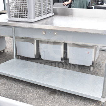 BRAND NEW SCRATCH AND DENT Regency 600TB3072G table with under shelf, stainless steel, minor surface scratches, sturdy construction.