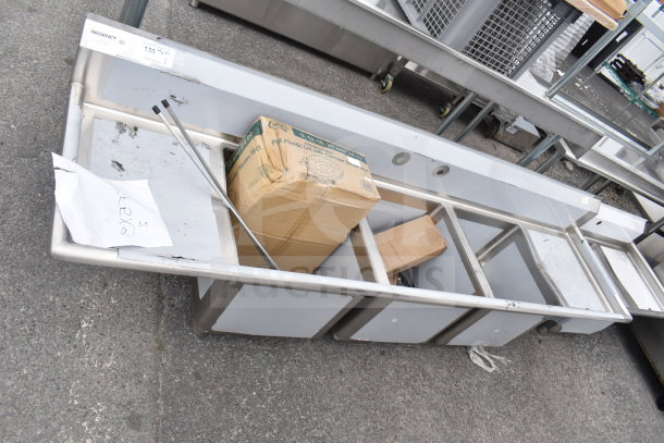 BRAND NEW Regency 600S31818218 3 Bay Sink with dual drain boards, visible scratches and dents, includes packaging.
