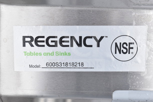 Regency 600S31818218 3 Bay Sink, dual drain boards, brand new, scratch and dent condition. NSF-certified label visible.