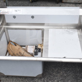 Brand new Steelton 522CS11818R commercial stainless steel sink, 18-gauge, with right drainboard, visible labels, minor scratches.