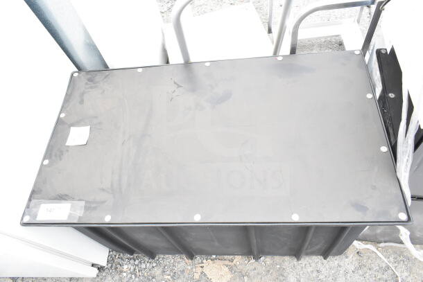 Ashland PolyTrap 4875 grease trap, 150 lb. capacity, threaded connections. Black plastic, good condition. Labels visible.