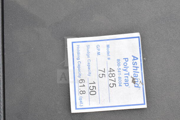 Ashland PolyTrap 4875 grease trap, 150 lb. capacity, threaded connections. Label shows model 4875, 75 GPM, 150 sludge capacity, 61.8 gal holding capacity.