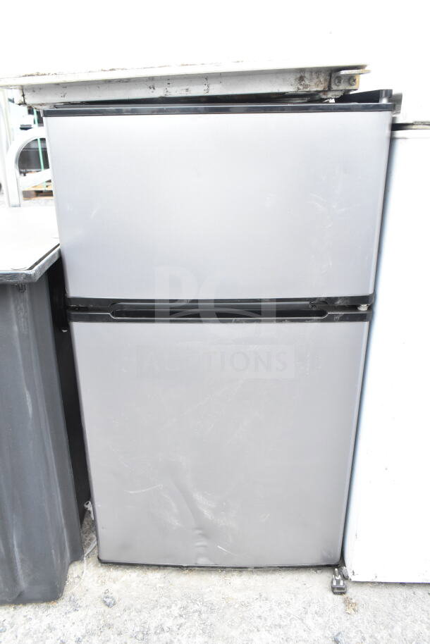 Haier mini cooler, gray, slight wear, 120V, 1 phase, auction includes three items: Haier, Mainstays cooler, Hisense freezer.