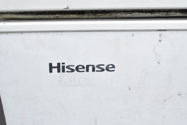 Hisense chest freezer showing brand label, part of auction lot with Haier and Mainstays mini coolers, 120 volts, 1 phase.