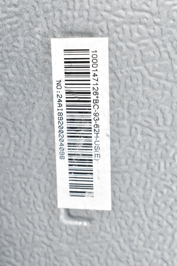 Barcoded label on a mini cooler's textured surface, showing numbers 1000147126BC, 93-62H, and NO:24A189200204098.