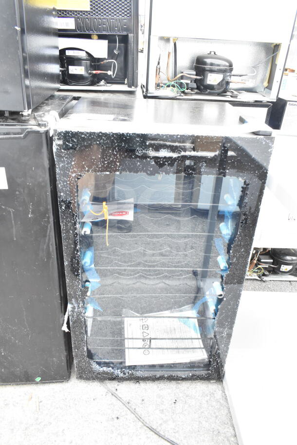 Arctic King AWCA034ADB wine cooler with glass damage, features wire shelves and black finish.