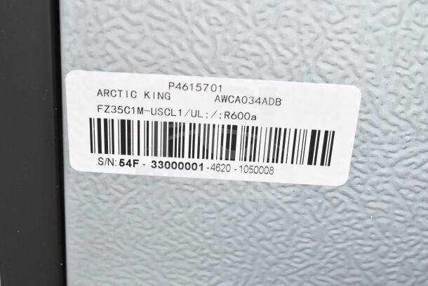 Arctic King AWCA034ADB wine cooler label, showing model, serial number, and refrigerant type. Glass damage noted.
