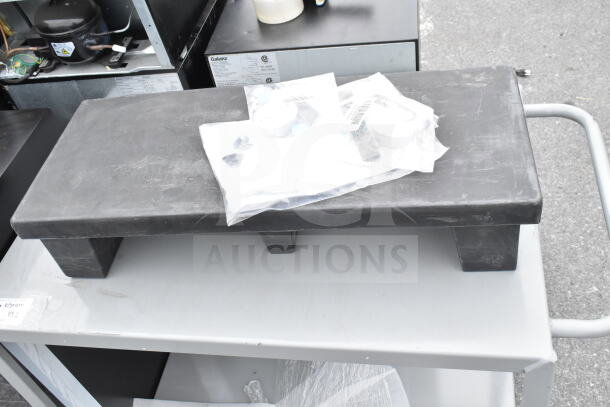 Brand new gray 2-tier cart with a black dunnage rack, minor scratches. Includes packaged accessories. Two items per bid.
