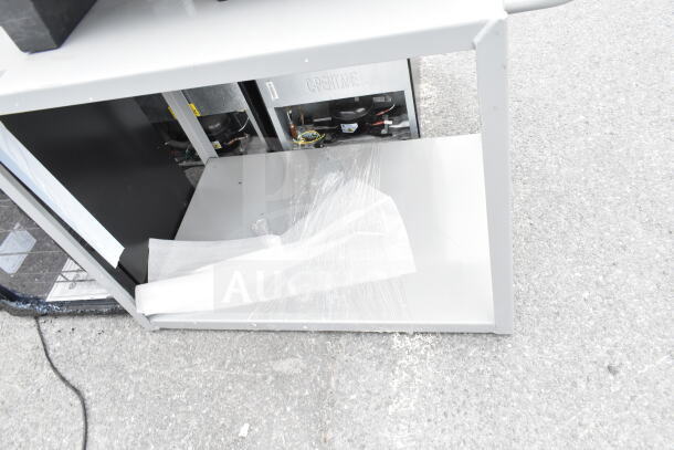 Gray 2-tier cart and black dunnage rack, brand new with minor scratches and dents. Packaging material visible.