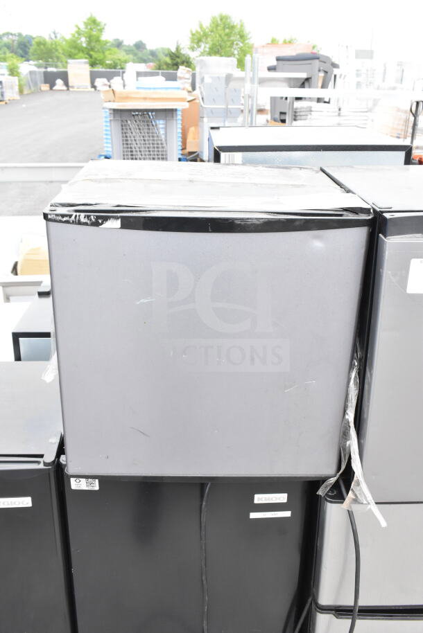 Five mini coolers, including Galanz and Igloo brands, are stacked. Each operates at 115 volts, 1 phase. Minimal wear.