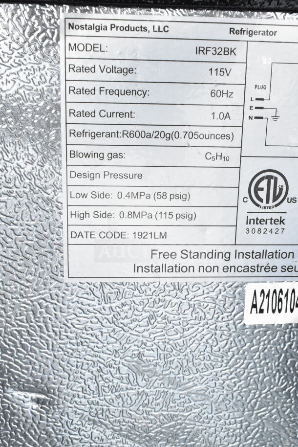 Label on mini cooler indicating model IRF32BK, 115V, 60Hz, 1.0A, refrigerant R600a. For freestanding installation.
