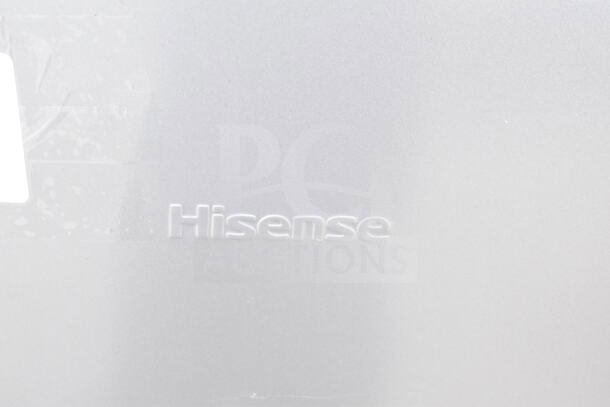 Hisense Mini Cooler detail, showing brand logo on a silver surface. Part of auction lot with Frigidaire Freezer, Galanz Mini Cooler.