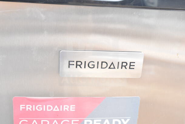 Frigidaire freezer with brand nameplate and "Garage Ready" label, stainless steel finish, 115 volts, 1 phase.