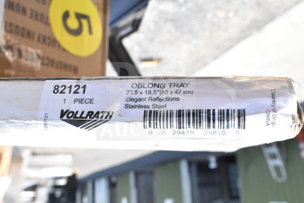 Vollrath oblong tray label showing item number 82121, dimensions 23.5x18.5 inches, stainless steel, made in China.