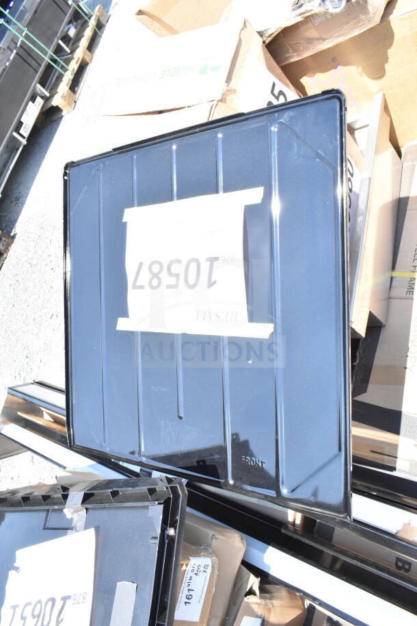 Alt text: Scratch and dent items including speed rail, canopy tent, and serving trays. Boxes labeled with item codes.
