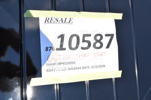 Label on auction item with number 10587, cautioning sharp edges. Item #: HP4524992, RA #: 3416444, Date: 3/12/2026.