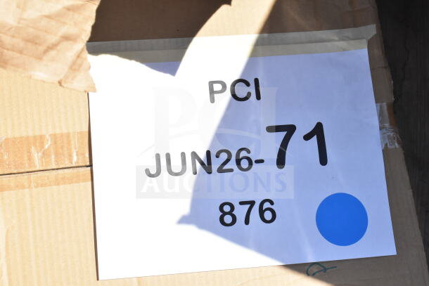 Cardboard box with a label reading "PCI JUN26-71 876." Contains 8 new scratch and dent items, including meat trays and a shelf kit.