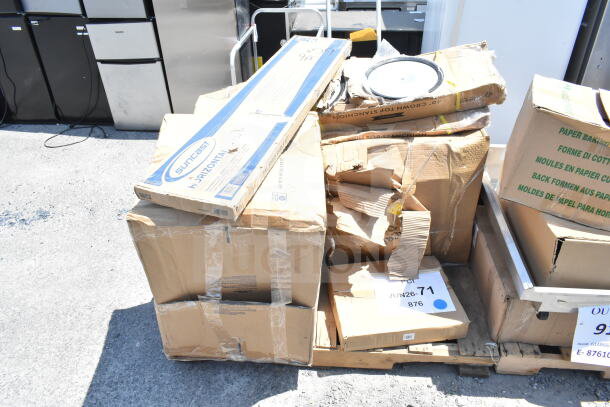 8 new items, including meat trays and shelf kit. Scratch and dent condition. Box labeled "Suncast" and "JUN26-71".