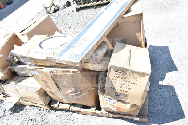 Boxes of scratch and dent items including meat trays, shelf kit, on pallet. Boxes marked "HAND SINK" and "HORIZONTAL SHED SHELF KIT."