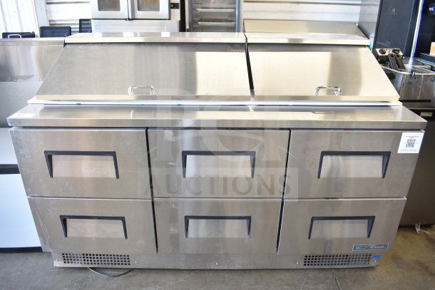 Brand new 2026 True TFP-72-30M-D-6-HC refrigerated prep table with six drawers, 115V, visible minor dents.