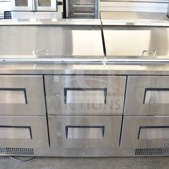 Brand new 2026 True TFP-72-30M-D-6-HC refrigerated prep table with six drawers, 115V, visible minor dents.