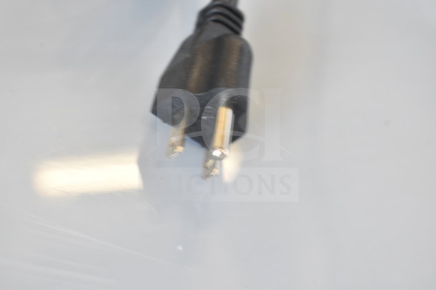 Close-up of a power plug for Avantco 194MCF430A ice machine, showing standard prongs and black casing.