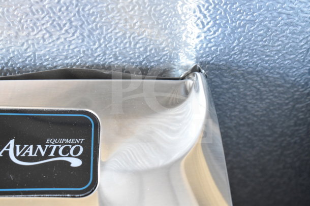 Brand new Avantco 177LT93 24 Tray Stainless Steel Food Dehydrator with a visible dent, logo displayed.