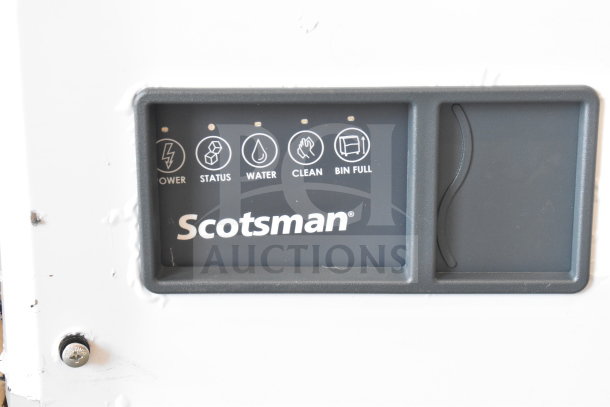 Scotsman MC0322MAX-1A ice machine control panel featuring power, status, water, clean, and bin full indicators.