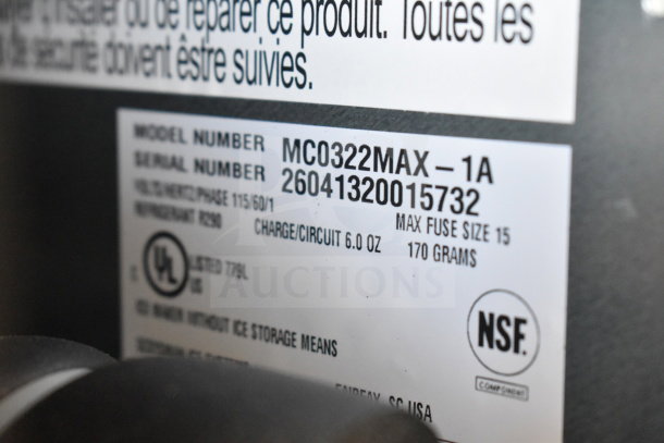Label on Scotsman MC0322MAX-1A ice machine; shows model, serial number, 115 volts, NSF certified.