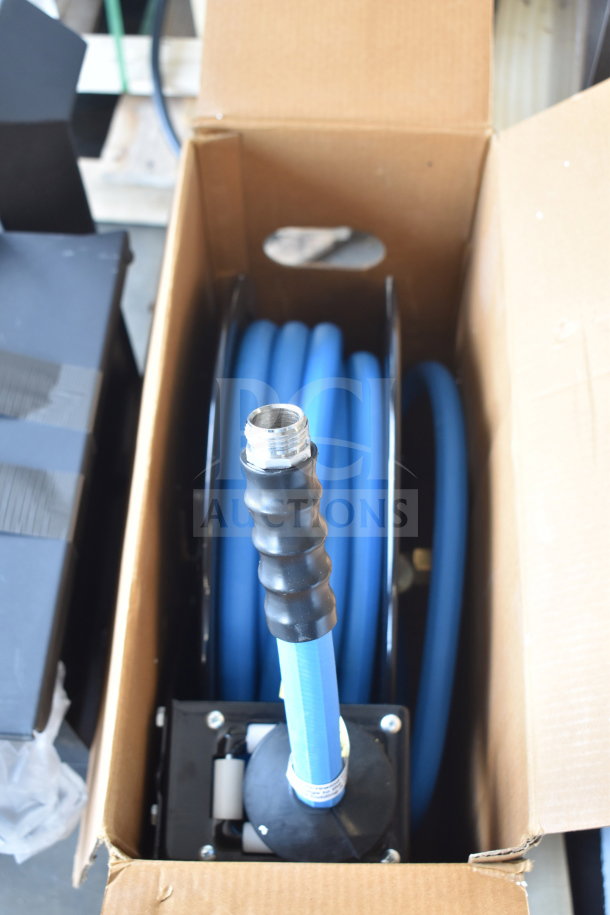 BRAND NEW 600HRPC3430 Regency hose reel with 30' x 3/4" blue hose, black powder-coated steel, in open box.