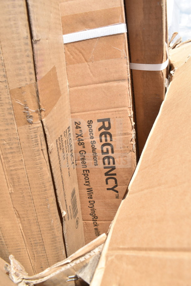 Cardboard boxes labeled "Regency Space Solutions 24x48 Green Epoxy Wire Drying Rack," part of a 14-item auction set.