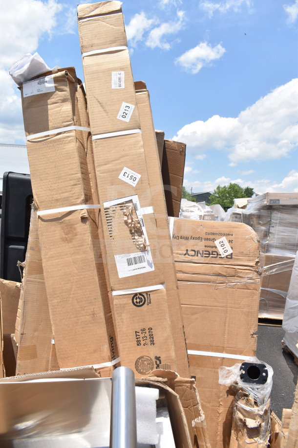 Cardboard boxes containing 14 brand new scratch and dent items including a sink, wall shelf, and posts, with various shipping labels.