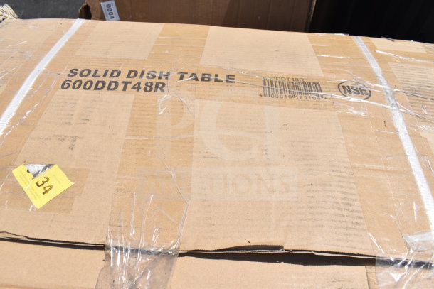 Cardboard box labeled "Solid Dish Table 600DDT48R," unopened, showing minor scratches. Marked NSF, with auction tag 34.