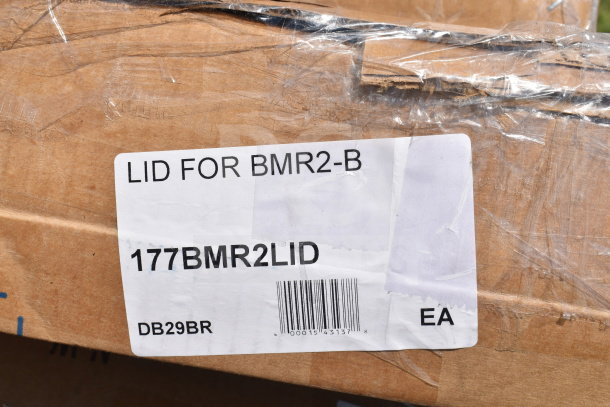 Cardboard box with label reading "LID FOR BMR2-B, 177BMR2LID, DB29BR, EA." Part of a scratch and dent auction lot.