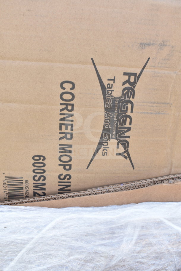Regency corner mop sink in cardboard box, labeled model 600SM1236, part of 18 new scratch and dent items.